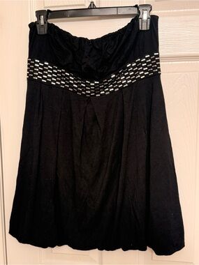 Cake Black sleeveless top.  Balloon hem Silver Beaded neckline